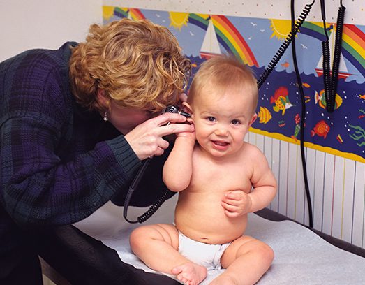 Baby receiving pediatric care