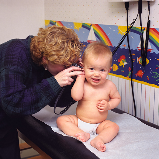 Baby receiving pediatric care