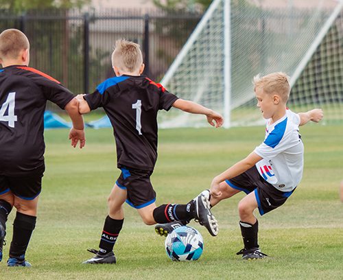 Kids playing soccer after physical exam