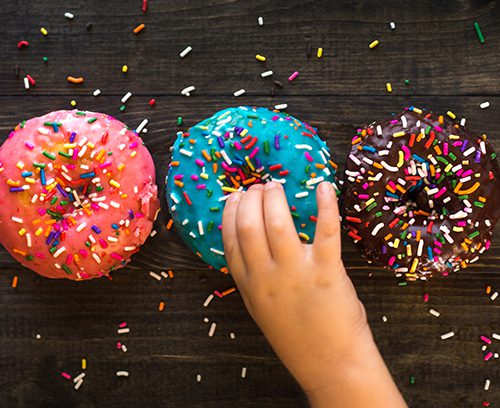 Child reaching for donut - Obesity Management for Kids